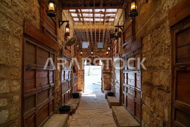 Traditional alleyway and wooden shopfronts in Yanbu's historic Night Market in Saudi Arabia Traditional alleyway and wooden shopfronts in Yanbu's historic Night Market in Saudi Arabia