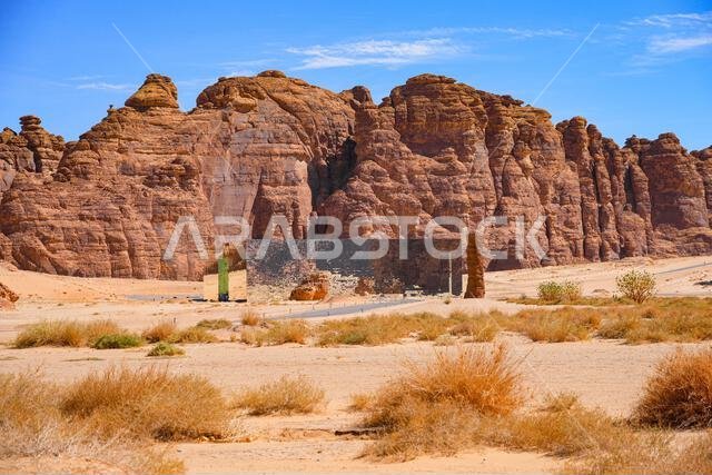 The Maraya mirrored concert hall reflecting the ancient desert mountains of Ashar Valley in AlUla, Saudi Arabia