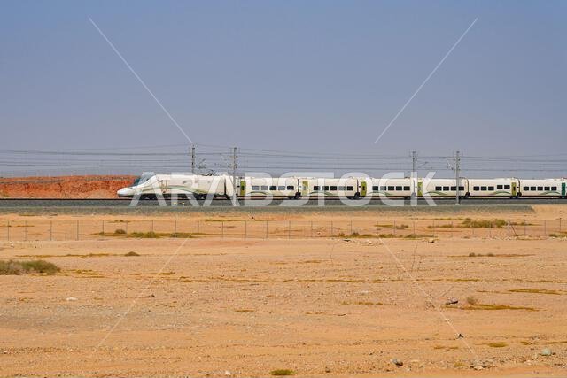 Haramain High Speed Train model Talgo 350 speeding through the Saudi Arabian desert between Medina and Mecca