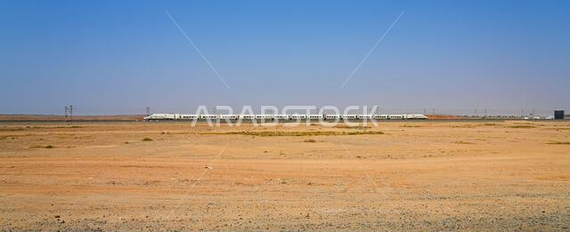 Haramain High Speed Train model Talgo 350 speeding through the Saudi Arabian desert between Medina and Mecca