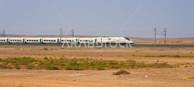 Haramain High Speed Train model Talgo 350 speeding through the Saudi Arabian desert between Medina and Mecca