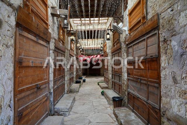 Traditional alleyway and wooden shopfronts in Yanbu's historic Night Market in Saudi Arabia
