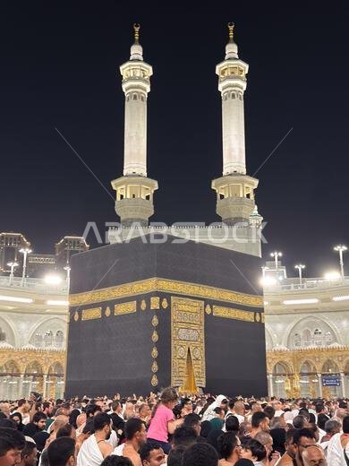Pilgrims gathered around the Kaaba at Masjid al-Haram in Mecca during night prayer