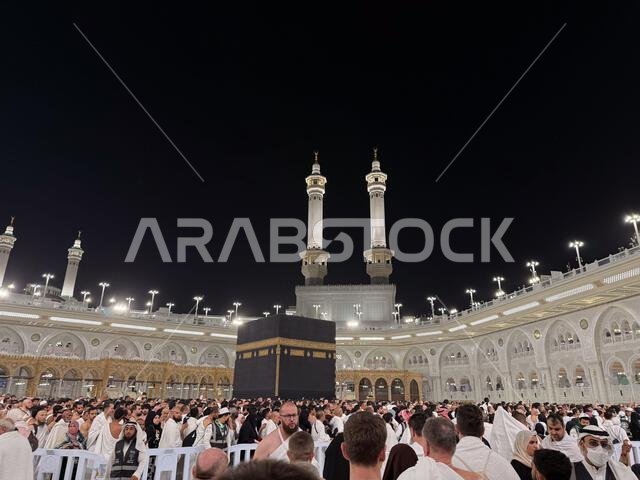 Pilgrims circling the Kaaba at Masjid al-Haram in Mecca during night prayer and Islamic pilgrimage