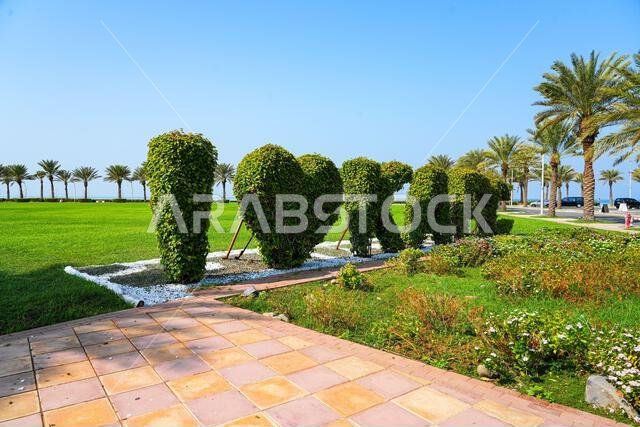 I Love KAEC topiary sign in a lush green park in King Abdullah Economic City, Saudi Arabia