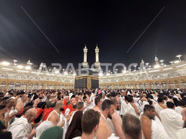 Pilgrims circling the Kaaba at Masjid al-Haram in Mecca during crowded night pilgrimage