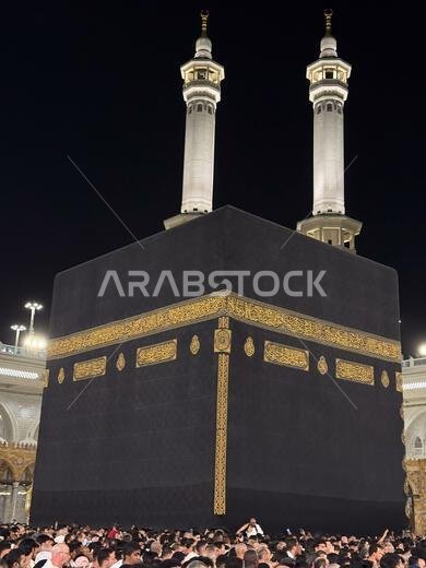 Pilgrims circling the Kaaba in Mecca at night inside Masjid al-Haram during pilgrimage