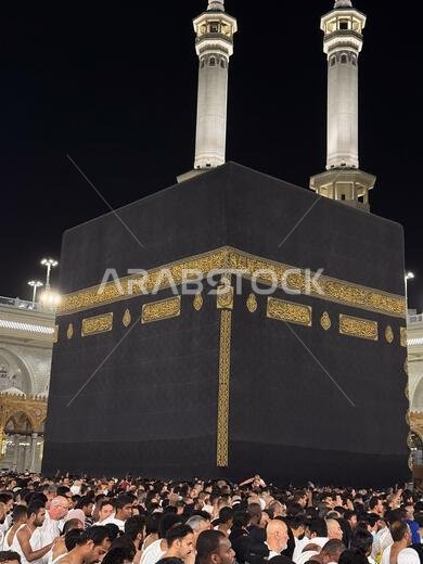 Kaaba in Mecca at night with pilgrims performing tawaf during Hajj and Umrah pilgrimage