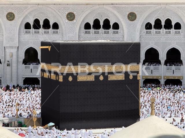 Pilgrims praying around the Kaaba at Masjid al-Haram during Hajj pilgrimage in Mecca