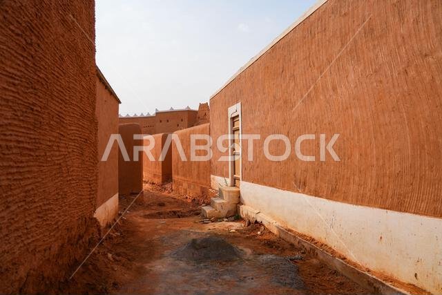 Traditional narrow alleyway in the historic mud brick village of Shaqra, Saudi Arabia