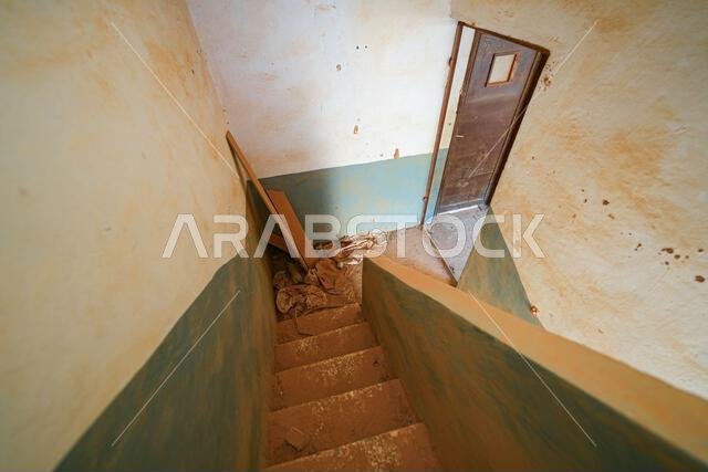 Traditional mud brick staircase inside a heritage house in Shaqra, a historical desert village in Riyadh Province, Saudi Arabia