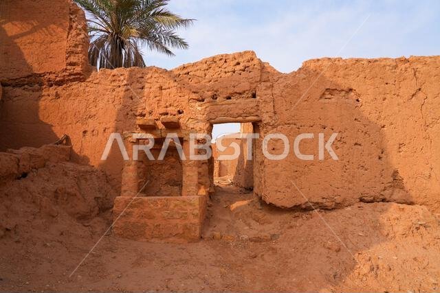 Ancient mud brick ruins and traditional water well in the historic village of Shaqra, Saudi Arabia