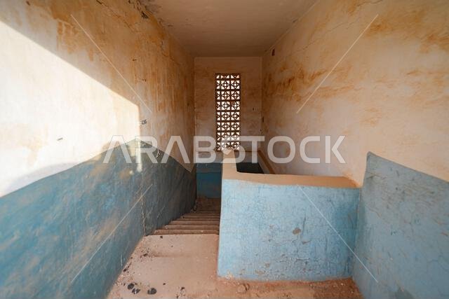 Traditional mud brick staircase inside a heritage house in Shaqra, a historical desert village in Riyadh Province, Saudi Arabia