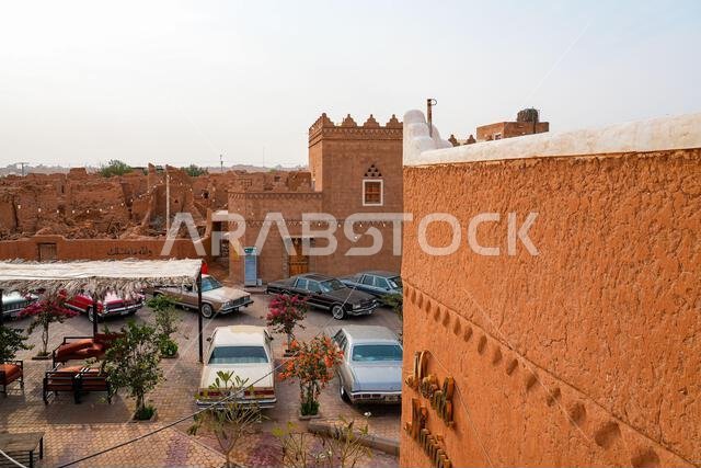 Classic vintage cars parked in the historic mud brick village of Shaqra in Saudi Arabia