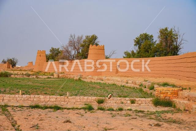 Perspective of historic desert ramparts and clay towers in the historic village of Shaqra, Saudi Arabia