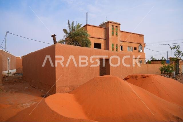 Traditional red sand for adobe restoration in the historic village of Shaqra, Saudi Arabia