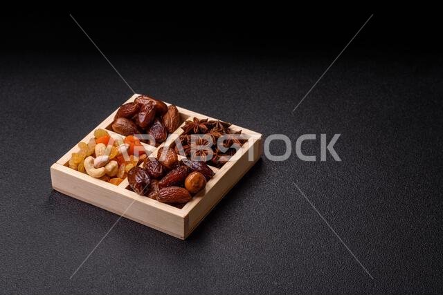 Dried dates on a ceramic plate for Ramadan or Iftar. Dried dates as a food background for your design