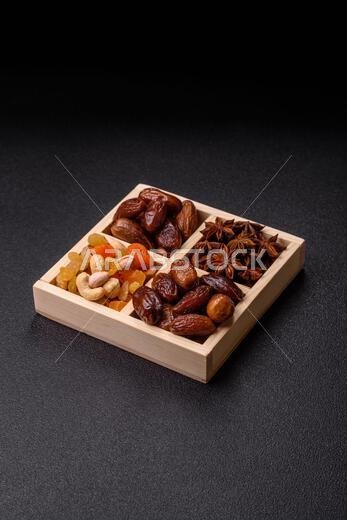 Dried dates on a ceramic plate for Ramadan or Iftar. Dried dates as a food background for your design