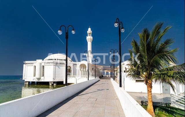 Exterior view of the Al Rahma Floating Mosque on the Red Sea coast in Jeddah, Saudi Arabia, during a bright sunny day