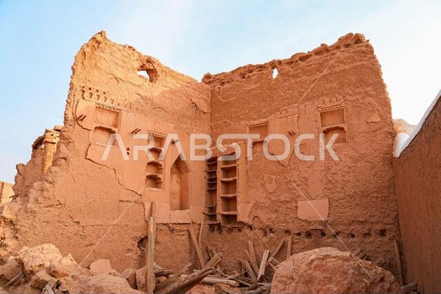 Ancient mud brick ruins and decorative wall niches in the historic village of Shaqra in Saudi Arabia
