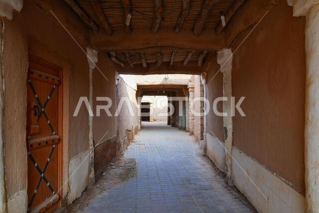 Traditional covered alleyway and adobe architecture in the historic village of Shaqra, Saudi Arabia