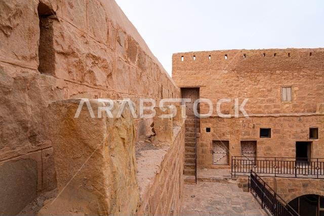Inner courtyard and multi-level stone architecture of the historic Tabuk Castle, an ancient Ottoman fortress along the Hajj pilgrimage route in Saudi Inner courtyard and multi-level stone architecture of the historic Tabuk Castle, an ancient Ottoman fortress along the Hajj pilgrimage route in Saudi