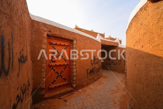 Traditional narrow alleyway in the historic mud brick village of Shaqra, Saudi Arabia