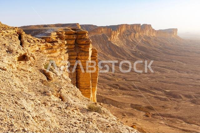The Edge of the World (Jebel Fihrayn), a breathtaking 1,131-meter cliff located about 100 km northwest of Riyadh, Saudi Arabia at the golden hour
