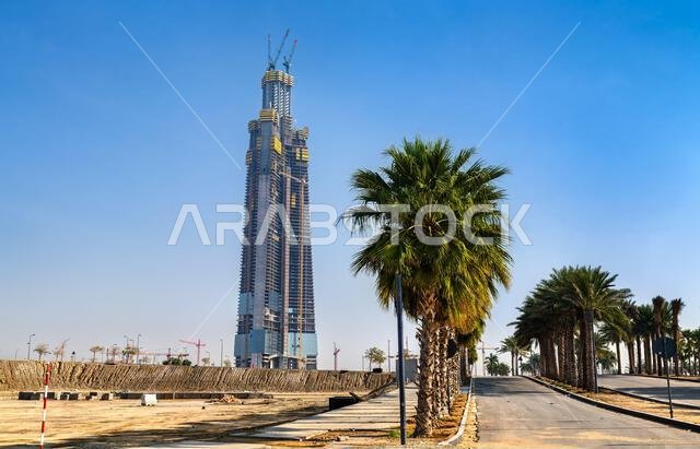 Jeddah, Saudi Arabia - February 11, 2026: Construction progress of the Jeddah Tower, set to be the tallest building in the world, viewed from a palm-lined road in the Abhur district. Jeddah, Saudi Arabia - February 11, 2026: Construction progress of the Jeddah Tower, set to be the tallest building in the world, viewed from a palm-lined road in the Abhur district.