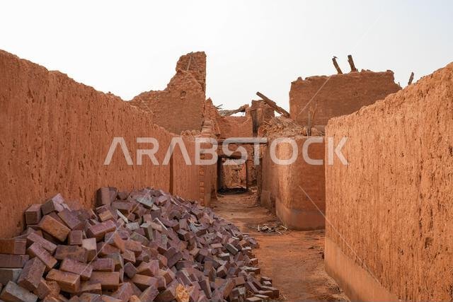 Narrow alleyway through ancient mud brick ruins in the historic village of Shaqra, Saudi Arabia