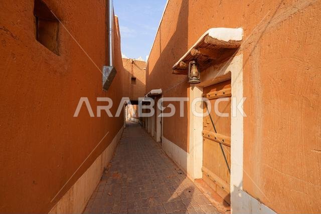 Traditional narrow alleyway in the historic mud brick village of Shaqra, Saudi Arabia