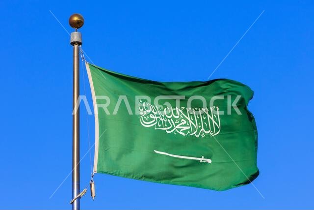 The national flag (The Fluttering Green) of Saudi Arabia flying proudly over Jeddah, Saudi Arabia