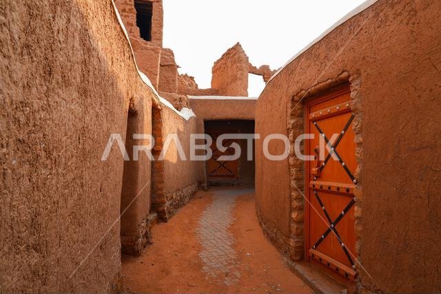 Traditional narrow alleyway in the historic mud brick village of Shaqra, Saudi Arabia