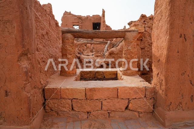 Ancient traditional water well and mud brick ruins in the historic village of Shaqra, Saudi Arabia