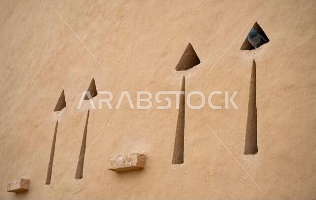 Abstract window openings in a wall in At-Turaif fort, Diriyah, Saudi Arabia Abstract window openings in a wall in At-Turaif fort, Diriyah, Saudi Arabia