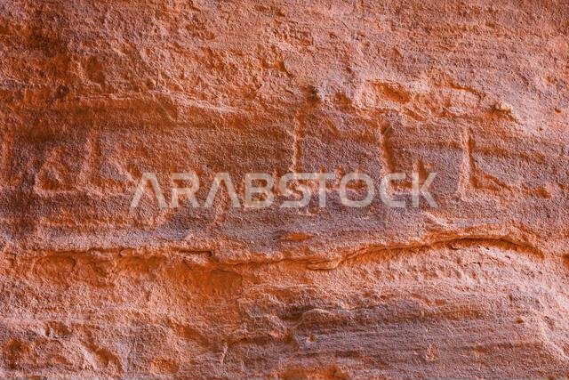 Ancient Nabataean inscriptions carved into the sandstone cliffs of Jabal Ithlib in Hegra, AlUla, Saudi Arabia