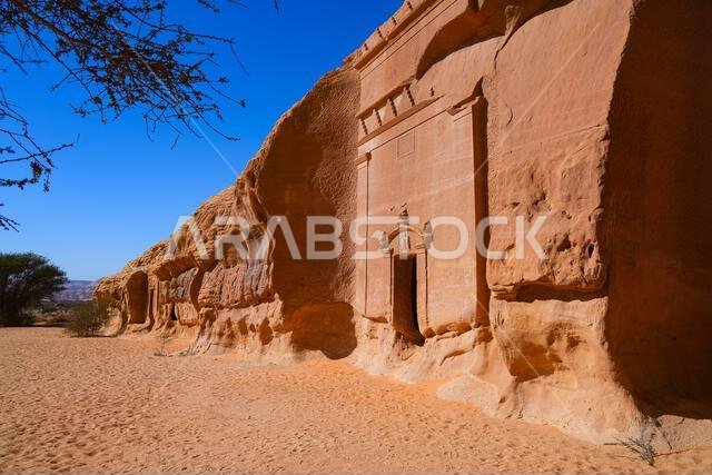 Ancient Nabataean rock-cut tombs at Jabal AlBanat necropolis in Hegra, AlUla, Saudi Arabia