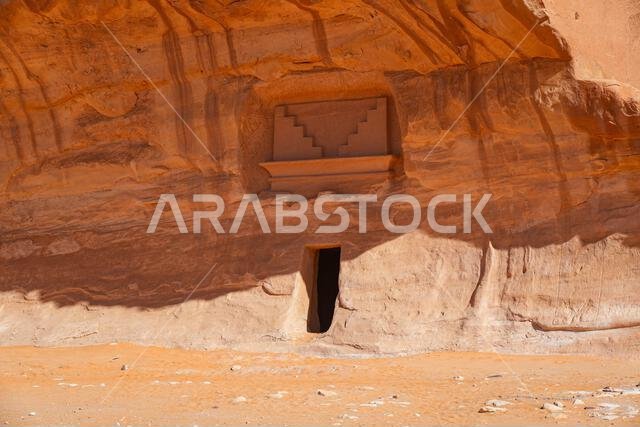 Unfinished Nabataean rock-cut tomb under a natural overhang at Jabal AlBanat in Hegra, AlUla, Saudi Arabia