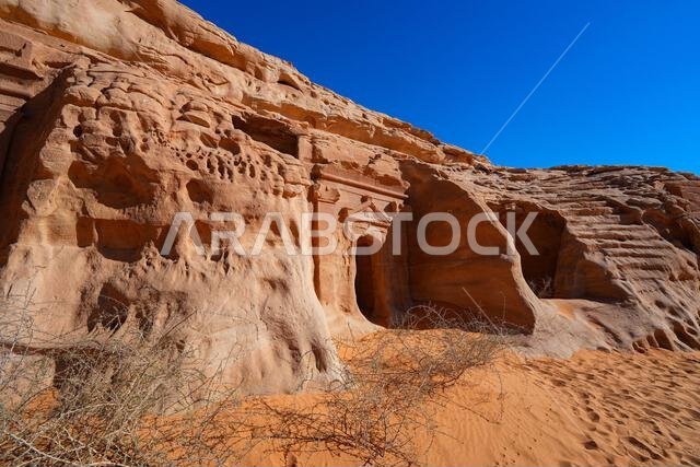 Ancient Nabataean rock-cut tombs at Jabal AlBanat necropolis in Hegra, AlUla, Saudi Arabia