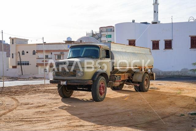 Classic vintage Mercedes-Benz tanker truck in the historic district of Umluj, Saudi Arabia Classic vintage Mercedes-Benz tanker truck in the historic district of Umluj, Saudi Arabia
