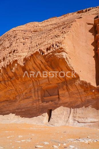Unfinished Nabataean rock-cut tomb under a natural overhang at Jabal AlBanat in Hegra, AlUla, Saudi Arabia