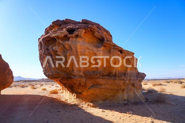 The majestic Jabal AlAhmar monolithic tombs in Hegra, AlUla, Saudi Arabia The majestic Jabal AlAhmar monolithic tombs in Hegra, AlUla, Saudi Arabia