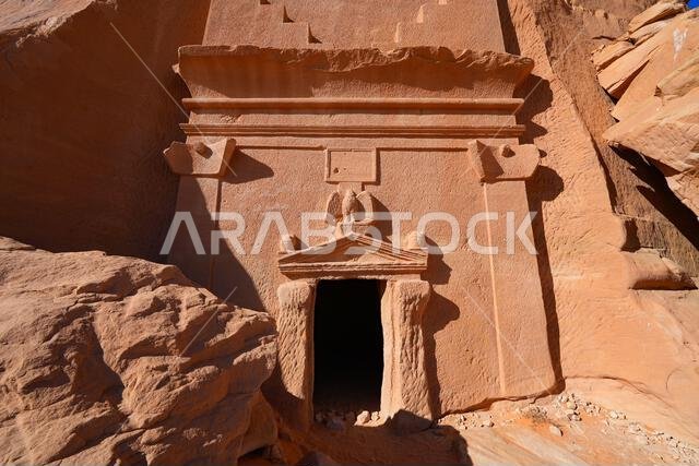 Close-up of a carved Nabataean eagle and inscription panel on a tomb of Jabal AlBanat in Hegra, AlUla, Saudi Arabia Close-up of a carved Nabataean eagle and inscription panel on a tomb of Jabal AlBanat in Hegra, AlUla, Saudi Arabia