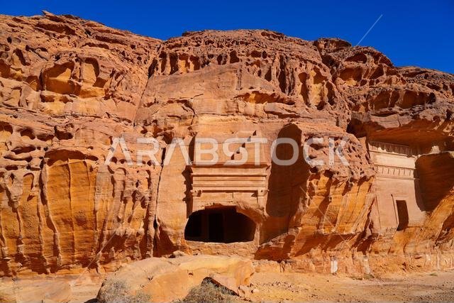 Solitary Nabataean tomb carved into a massive sandstone monolith in Hegra, AlUla, Saudi Arabia