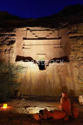 Hegra After Dark experience at the Jabal Al-Khuraymat site of Hegra - Nabataean tombs illuminated by lanterns in AlUla, Saudi Arabia
