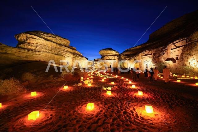 Hegra After Dark experience at the Jabal Al-Khuraymat site of Hegra - Nabataean tombs illuminated by lanterns in AlUla, Saudi Arabia Hegra After Dark experience at the Jabal Al-Khuraymat site of Hegra - Nabataean tombs illuminated by lanterns in AlUla, Saudi Arabia