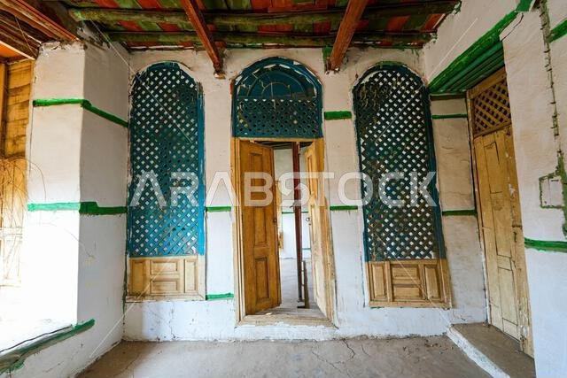 Interior of a traditional Hijazi house with triple wooden doors and moucharabiehs in Al-Balad, the Old Town of Jeddah, Saudi Arabia