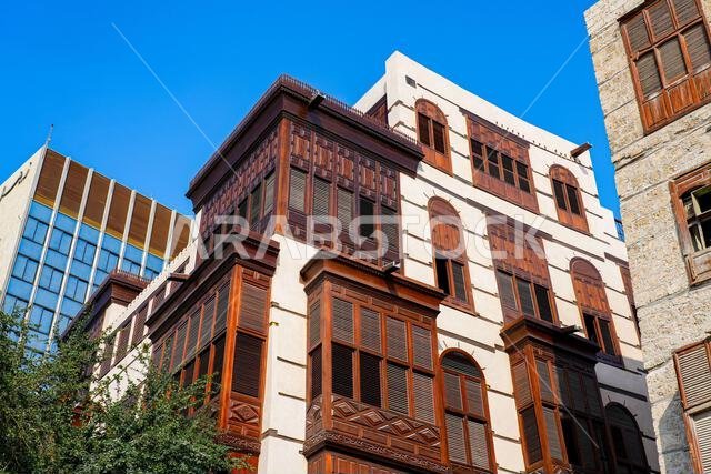 Traditional Hejazi building characterized by mashrabiya screens and wooden balconies in Al-Balad, the Old Town of Jeddah, Saudi Arabia
