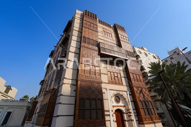 Traditional Hejazi building characterized by mashrabiya screens and wooden balconies in Al-Balad, the Old Town of Jeddah, Saudi Arabia