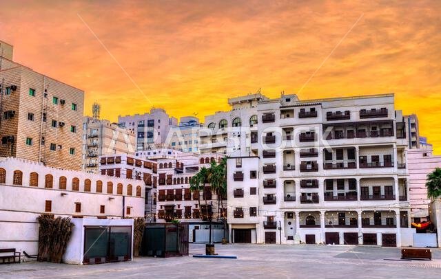 Golden sunset illuminating the traditional buildings and wooden lattice balconies in the UNESCO world heritage site of Al Balad, Jeddah, Saudi Arabia.